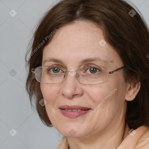 Joyful white adult female with medium  brown hair and grey eyes