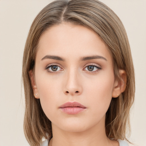 Neutral white young-adult female with long  brown hair and brown eyes