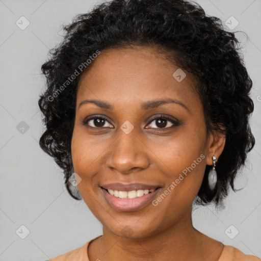 Joyful black young-adult female with long  brown hair and brown eyes