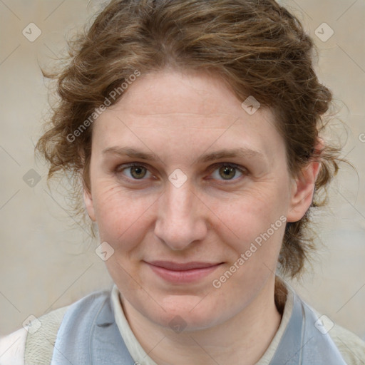 Joyful white adult female with medium  brown hair and blue eyes