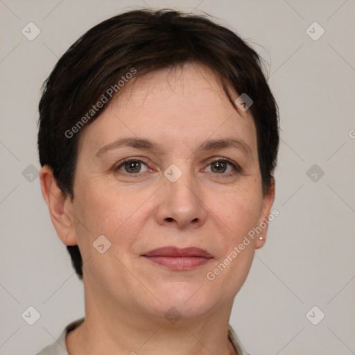 Joyful white adult female with short  brown hair and grey eyes