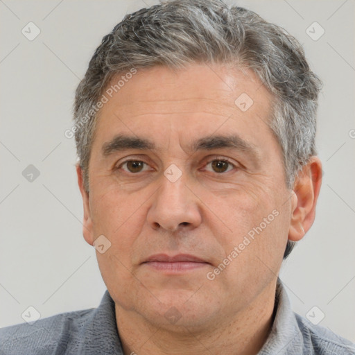 Neutral white middle-aged male with short  brown hair and brown eyes