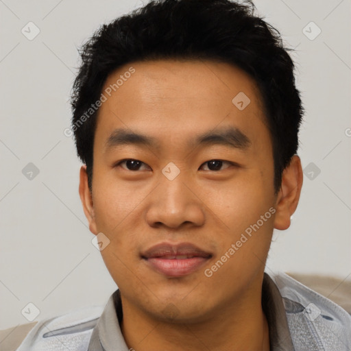 Joyful asian young-adult male with short  black hair and brown eyes