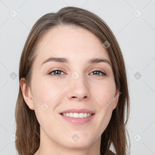 Joyful white young-adult female with long  brown hair and grey eyes