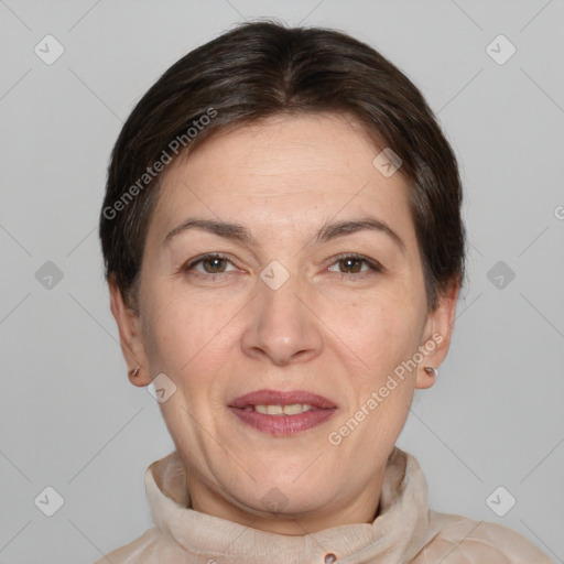 Joyful white adult female with short  brown hair and brown eyes