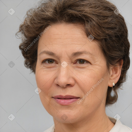 Joyful white middle-aged female with medium  brown hair and brown eyes