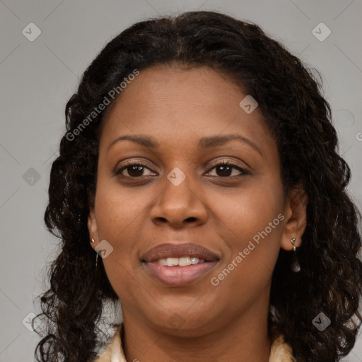 Joyful black young-adult female with long  brown hair and brown eyes