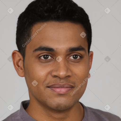 Joyful black young-adult male with short  black hair and brown eyes