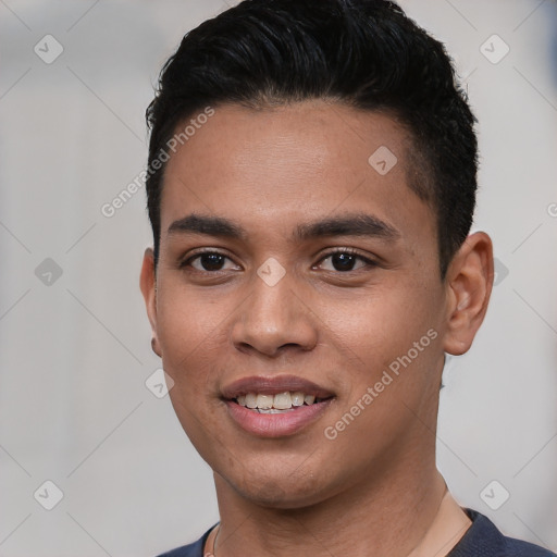 Joyful white young-adult male with short  black hair and brown eyes