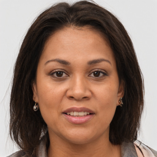 Joyful white adult female with medium  brown hair and brown eyes