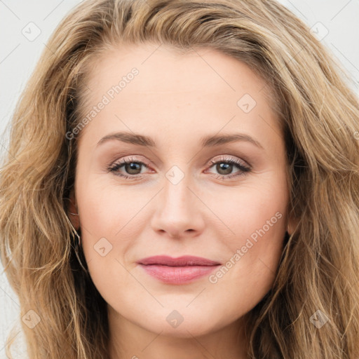 Joyful white young-adult female with long  brown hair and green eyes