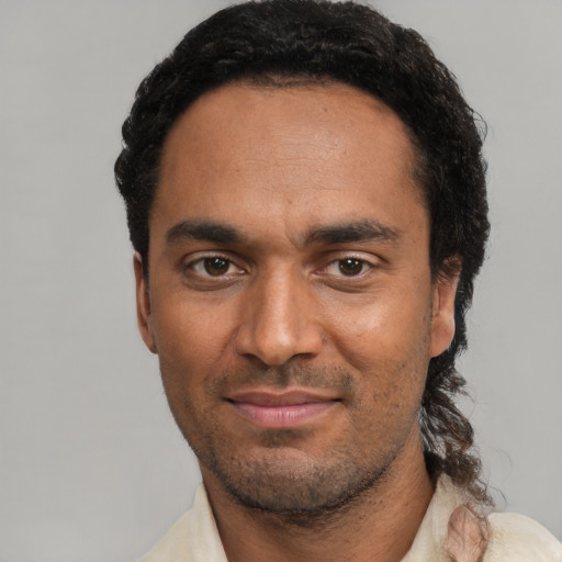 Neutral black adult male with short  black hair and brown eyes