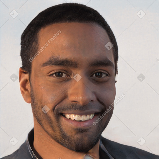 Joyful black young-adult male with short  brown hair and brown eyes