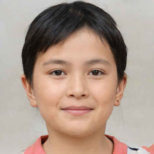 Joyful asian child female with short  brown hair and brown eyes