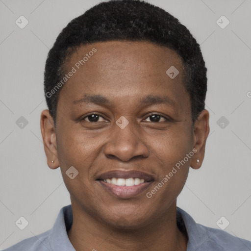 Joyful black young-adult male with short  black hair and brown eyes