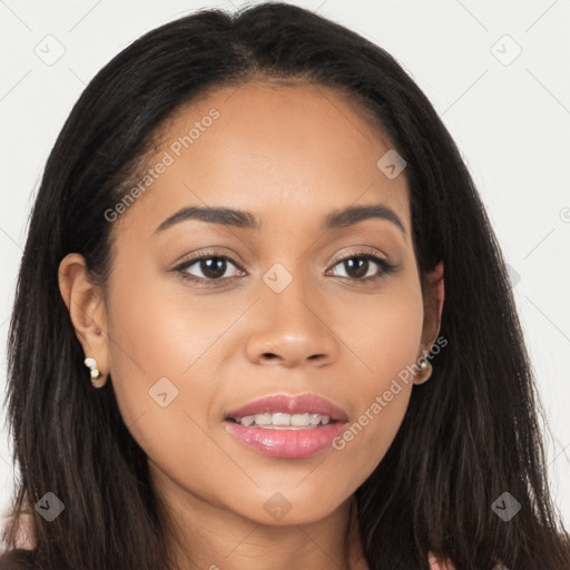 Joyful latino young-adult female with long  brown hair and brown eyes