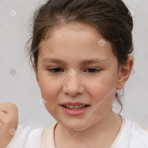 Joyful white child female with short  brown hair and brown eyes