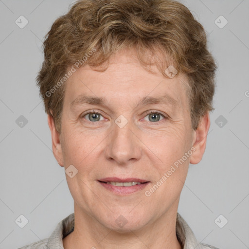 Joyful white adult male with short  brown hair and grey eyes