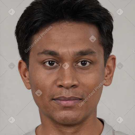 Joyful asian young-adult male with short  black hair and brown eyes