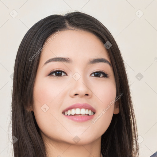 Joyful white young-adult female with long  black hair and brown eyes