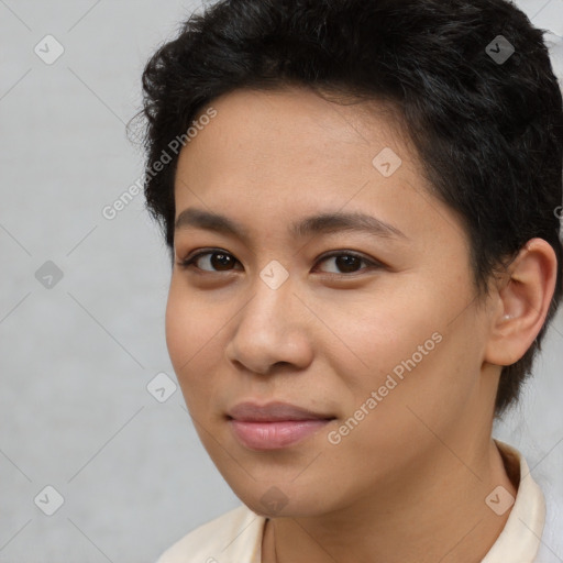 Joyful asian young-adult female with short  brown hair and brown eyes