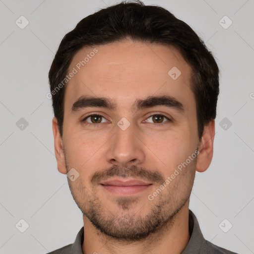 Joyful white young-adult male with short  black hair and brown eyes