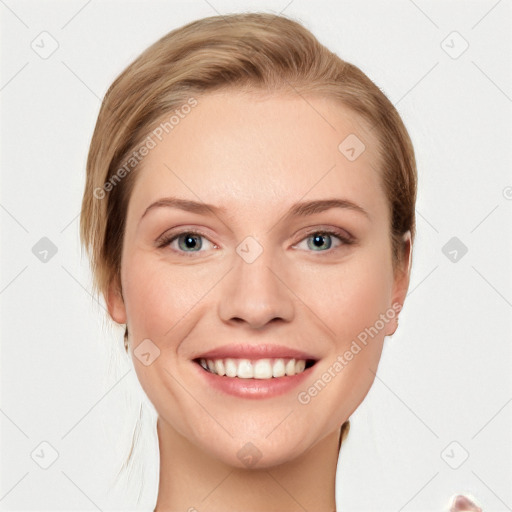 Joyful white young-adult female with medium  brown hair and blue eyes