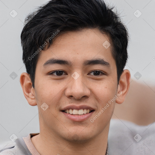 Joyful asian young-adult male with short  brown hair and brown eyes