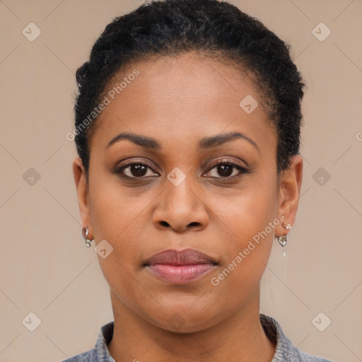 Joyful black young-adult female with short  brown hair and brown eyes