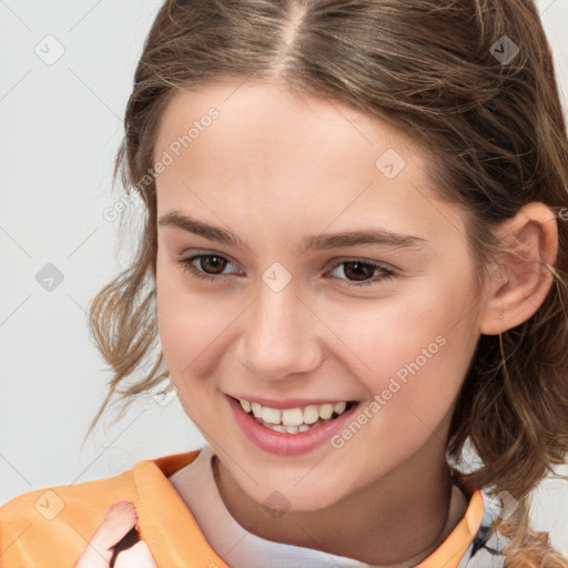 Joyful white child female with medium  brown hair and brown eyes