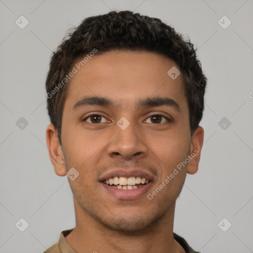 Joyful latino young-adult male with short  brown hair and brown eyes