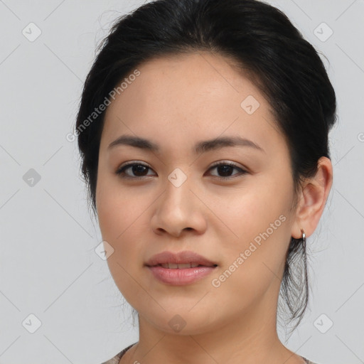 Joyful asian young-adult female with medium  black hair and brown eyes