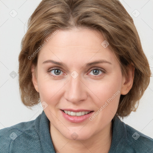 Joyful white adult female with medium  brown hair and blue eyes