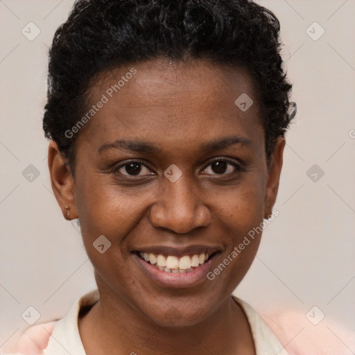 Joyful black young-adult female with short  brown hair and brown eyes