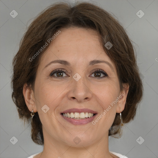 Joyful white adult female with medium  brown hair and brown eyes