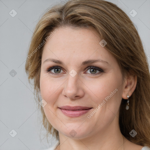 Joyful white adult female with medium  brown hair and brown eyes