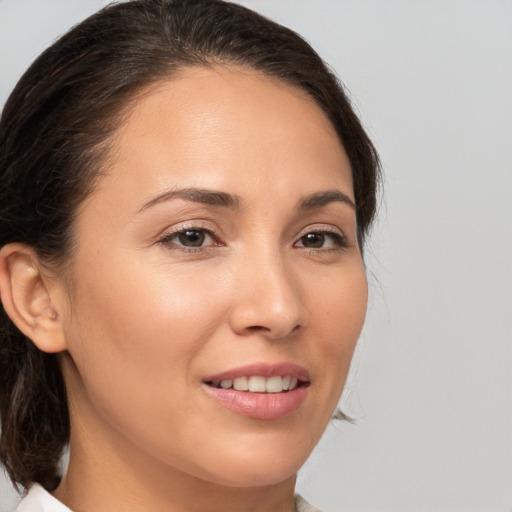 Joyful white young-adult female with medium  brown hair and brown eyes