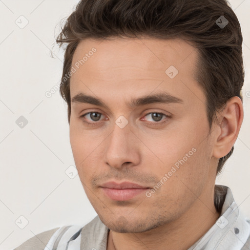 Neutral white young-adult male with short  brown hair and brown eyes