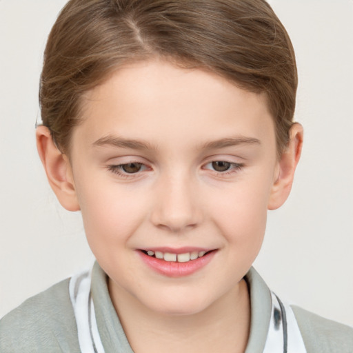 Joyful white child female with short  brown hair and grey eyes