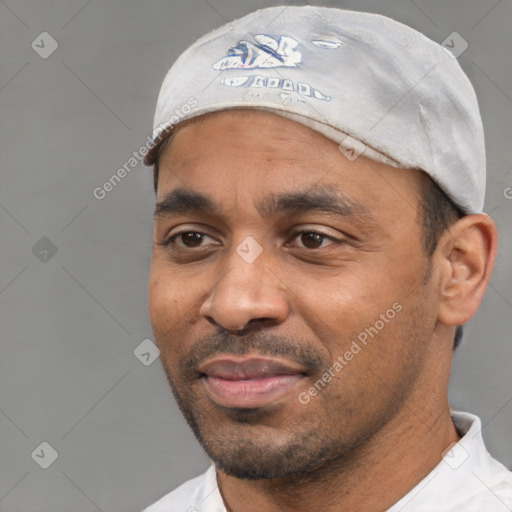 Joyful white adult male with short  black hair and brown eyes