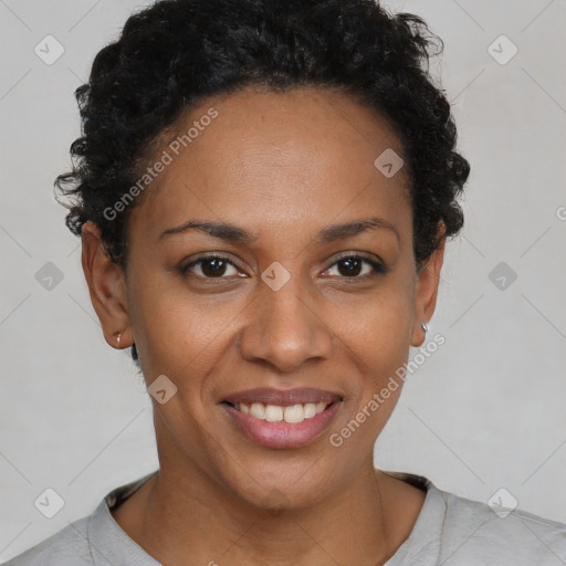 Joyful black young-adult female with short  brown hair and brown eyes