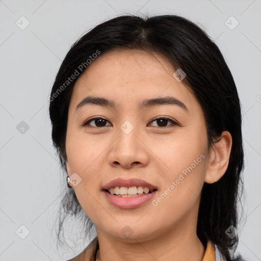 Joyful asian young-adult female with medium  black hair and brown eyes