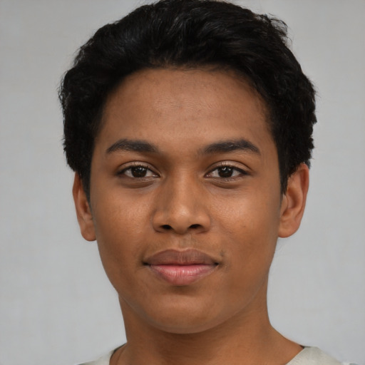 Joyful latino young-adult female with short  black hair and brown eyes