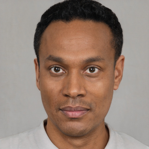 Neutral black young-adult male with short  black hair and brown eyes