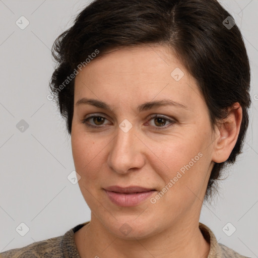 Joyful white adult female with short  brown hair and brown eyes