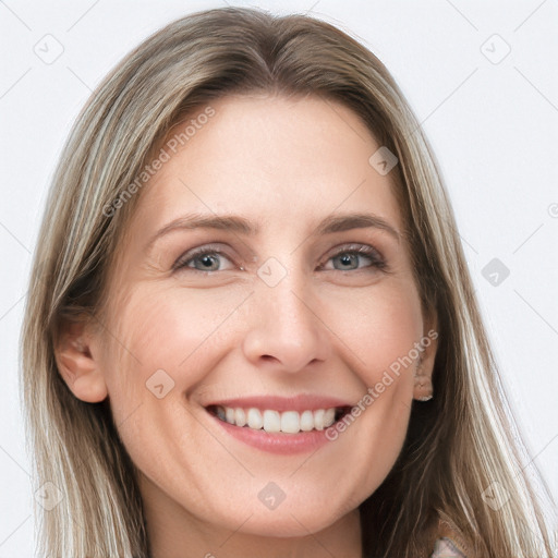 Joyful white young-adult female with long  brown hair and blue eyes