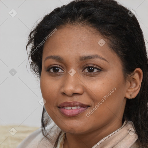 Joyful black young-adult female with long  brown hair and brown eyes