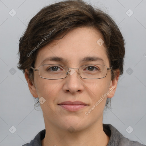 Joyful white adult female with short  brown hair and grey eyes