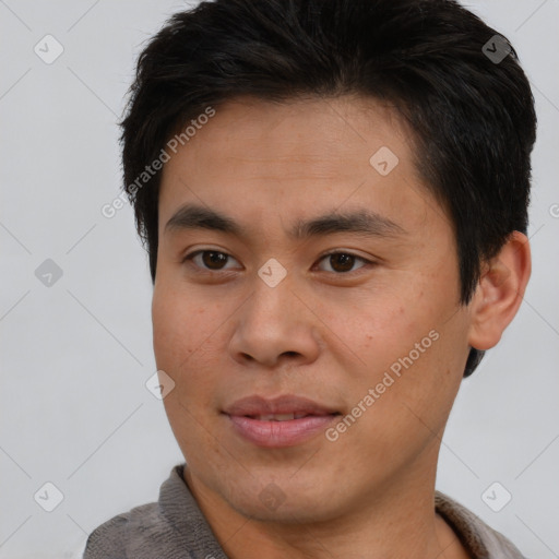 Joyful asian young-adult male with short  brown hair and brown eyes