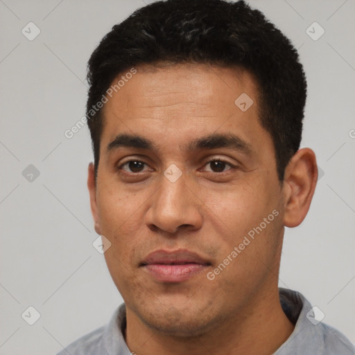 Joyful latino young-adult male with short  black hair and brown eyes